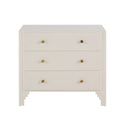 Commode élégante en blanc avec trois tiroirs et poignées dorées.